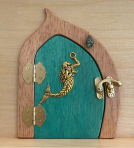 Teal handcrafted faerie door with mermaid charm and brown frame