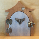 light blue handcrafted faerie door with brown frame