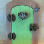 mint green handcrafted faerie door with light brown frame
