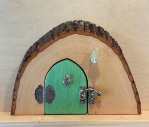 green handcrafted tooth faerie door