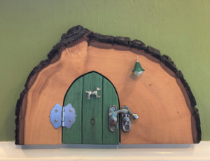 green handcrafted tooth faerie door
